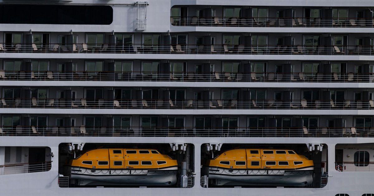 Close-up of a cruise ship showcasing lifeboats and passenger decks.