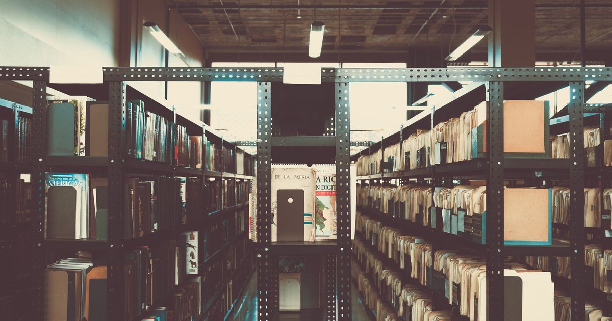 Bookshelves in a library with a vintage tone in San José, Costa Rica.