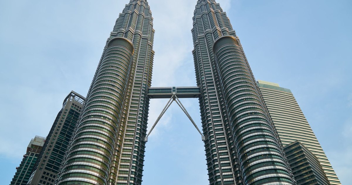 Stunning view of the Petronas Twin Towers against the blue sky in Kuala Lumpur, Malaysia.