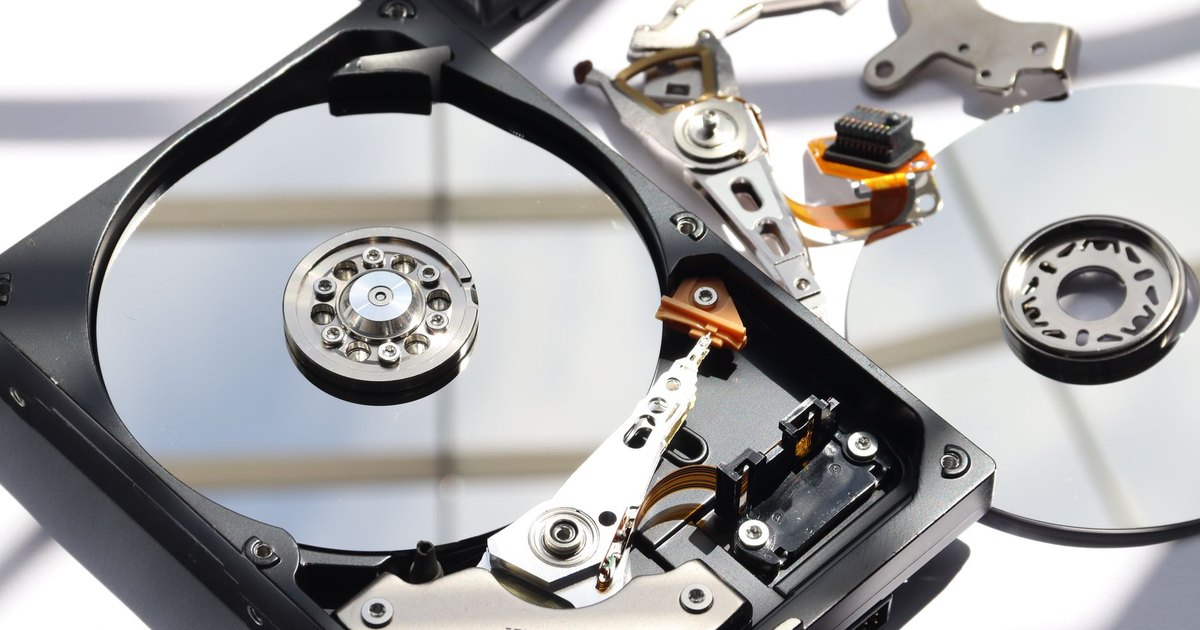 Detailed view of disassembled HDD showing intricate internal components.